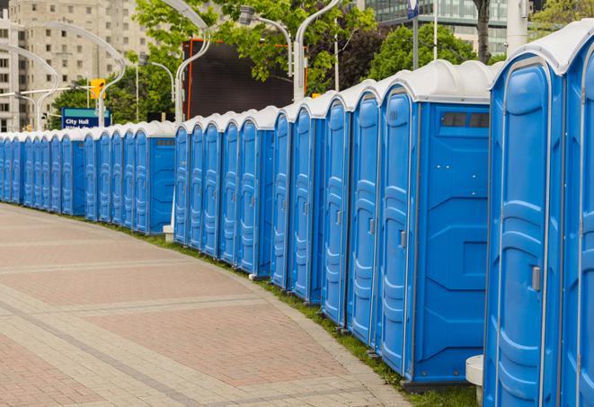 a row of portable restrooms at a fairground, offering visitors a clean and hassle-free experience in bruni
